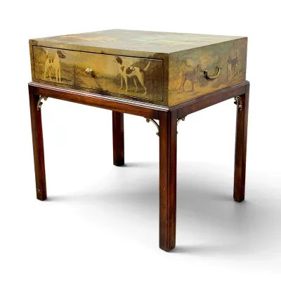 Sale Photo Thumbnail #18: Maitland-Smith style mahogany side table featuring a hand-painted hunt scene with various dog breeds on the drawer and sides, supported by straight legs with brass corner brackets.