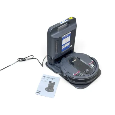 Sale Photo Thumbnail #169: Shark IQ Robot Self-Empty XL robot vacuum cleaner with its charging base and owner's guide.