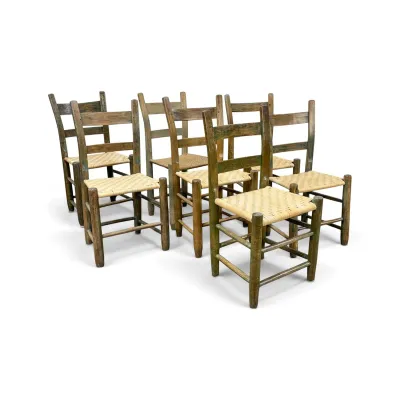Sale Photo Thumbnail #173: Set of six rustic ladder-back dining chairs with woven rush seats and a distressed green-painted finish.