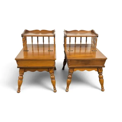 Sale Photo Thumbnail #99: Pair of vintage mid-century maple step-back end tables featuring spindle-supported upper shelves, hinged storage compartments, and turned legs.