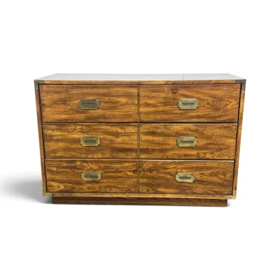 Sale Photo Thumbnail #57: Mid-century modern campaign-style six-drawer dresser with brass flush-mount pulls and corner brackets.
