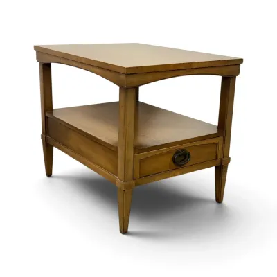 Sale Photo Thumbnail #134: Mid-century modern style wooden two-tier end table featuring a single drawer with a metal pull and tapered legs.