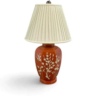 Sale Photo Thumbnail #15: Vintage Chinoiserie table lamp featuring a burnt orange ceramic ginger jar base with raised white cherry blossom branch details, topped with a pleated cream fabric shade.