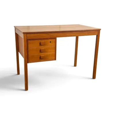 Sale Photo Thumbnail #12: Mid-century modern teak writing desk featuring a floating three-drawer cabinet with square wooden pulls and a keyhole on the top drawer.