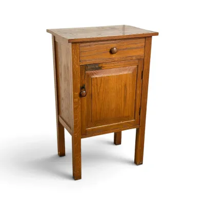 Sale Photo Thumbnail #74: Antique oak washstand or nightstand featuring a single drawer over a cabinet door with wooden knobs, showing some wear and character on the top surface.