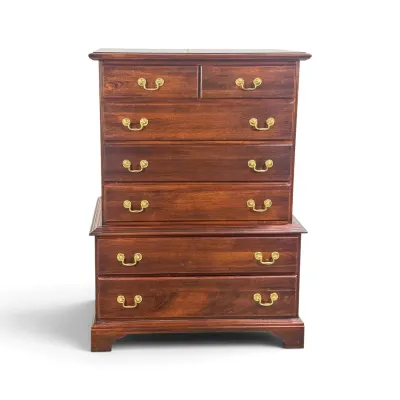 Sale Photo Thumbnail #10: Traditional mahogany chest-on-chest dresser featuring brass batwing drawer pulls and bracket feet, in a classic Chippendale style.