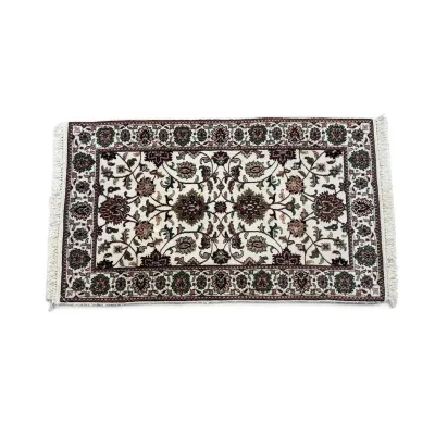Sale Photo Thumbnail #290: Small Persian-style accent rug featuring an intricate floral and vine pattern in burgundy, green, and beige tones with fringed ends.