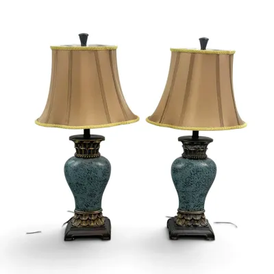 Sale Photo Thumbnail #13: Pair of traditional table lamps featuring mottled teal urn-style bases with ornate bronze-finished accents and matching tan bell shades.