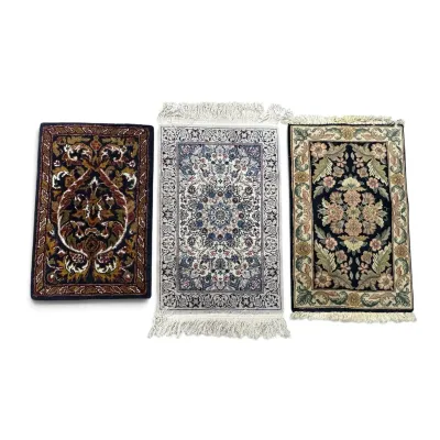 Sale Photo Thumbnail #294: Three small, intricately patterned Persian-style accent rugs, featuring traditional floral and geometric motifs in varied color palettes.