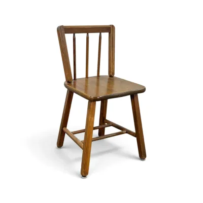 Sale Photo Thumbnail #202: Vintage child's wooden chair featuring a spindle back design and a warm, distressed finish.