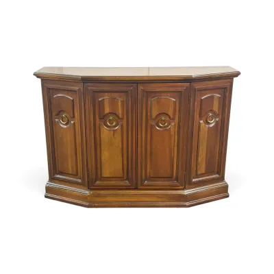 Sale Photo Thumbnail #5: Vintage four-door wooden credenza featuring a bowfront design, paneled cabinet doors, and brass ring pulls.