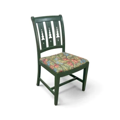 Sale Photo Thumbnail #199: Rustic green painted wooden dining chair featuring pine tree cutouts in the back splat and a floral tapestry upholstered seat.
