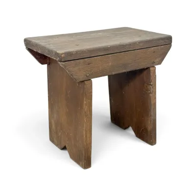 Sale Photo Thumbnail #195: Rustic, handmade wooden step stool or bench with a weathered brown finish and notched legs, showing signs of age and use.