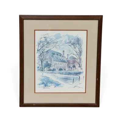 Sale Photo Thumbnail #323: Framed and matted watercolor and ink print depicting a historic brick building, signed by the artist in the lower right corner.