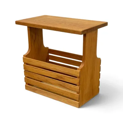 Sale Photo Thumbnail #160: Vintage oak magazine rack side table, featuring a slatted bin base and a flat top surface.