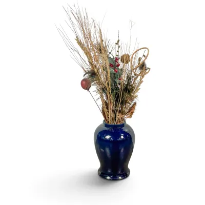 Sale Photo Thumbnail #80: Cobalt blue glazed ceramic vase filled with an arrangement of dried branches, peacock feathers, and faux berries.