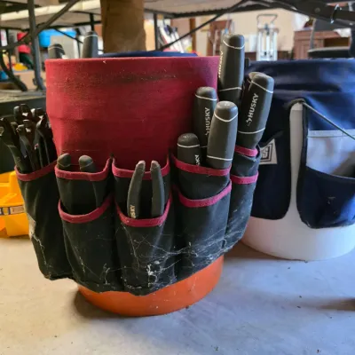 Sale Photo Thumbnail #43: Husky bucket tool organizer filled with various hand tools, including screwdrivers and pliers, showing some dust and cobwebs from storage.