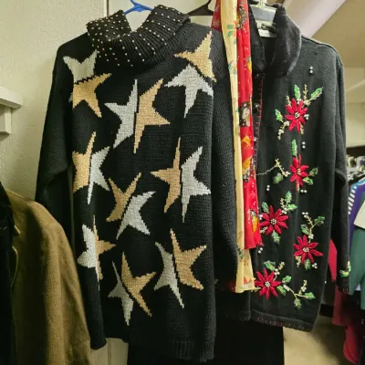 Vintage knit sweaters, including a black star-pattern turtleneck with stud detailing and a holiday cardigan featuring floral embroidery...