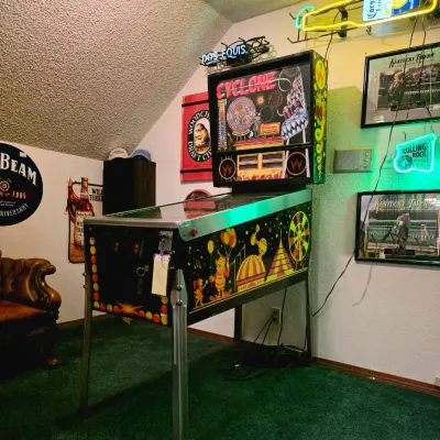 Williams Cyclone pinball machine, released in 1988, featuring a vibrant amusement park theme with colorful cabinet graphics and a...