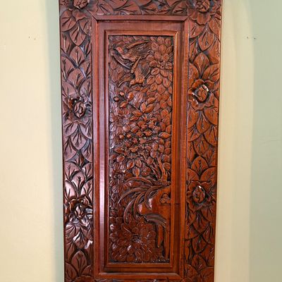Sale Photo Thumbnail #110: Intricately carved Asian-style wooden wall plaque featuring a central panel of birds and flowers surrounded by a floral border.
