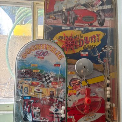 Sale Photo Thumbnail #279: Two vintage Wolverine toy bagatelle pinball games, featuring the "Boonville 500" and "500 Mile Speedway Game" race car themes, circa 1960s to 1970s.