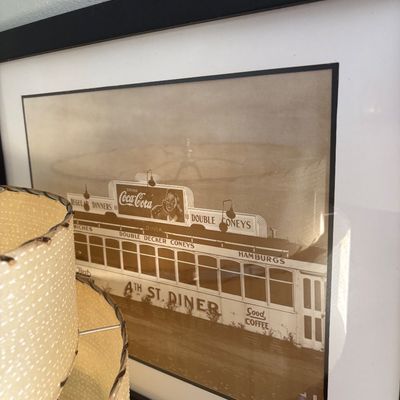 Sale Photo Thumbnail #270: Framed black-and-white photograph depicting the vintage 4th St. Diner, presented under glass in a simple black frame.