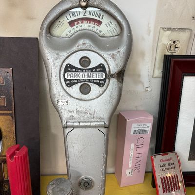 Sale Photo Thumbnail #392: Vintage silver-tone Park-O-Meter parking meter showing a two-hour limit, displaying some wear and patina from age.