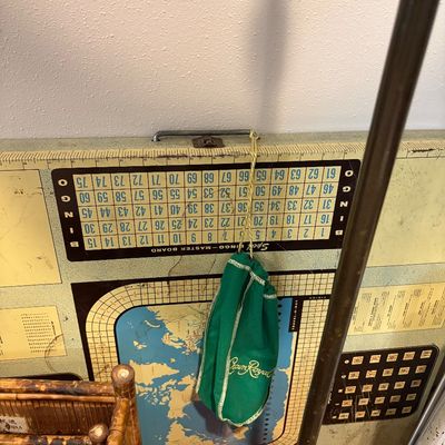 Sale Photo Thumbnail #245: Vintage folding game board featuring a bingo master board and world map