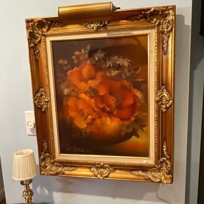 Vintage oil painting of orange poppies signed by Jenkins, housed in an ornate gilt gesso frame with an attached picture light.