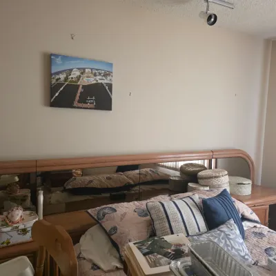 Sale Photo Thumbnail #73: Vintage 1980s laminate platform bed frame featuring a built-in mirrored headboard with integrated nightstands.