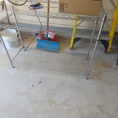 Sale Photo Thumbnail #111: Three-tier chrome wire shelving unit, suitable for garage or utility storage.
