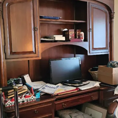Sale Photo Thumbnail #2: Large traditional wooden executive desk with a matching hutch, featuring built-in cabinets, shelving, and multiple drawers.
