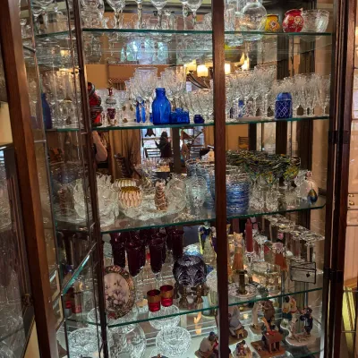 Sale Photo Thumbnail #12: glass curio cabinet filled with crystal stemware and decoratives