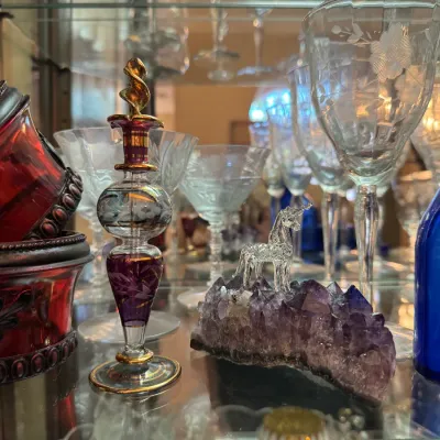 Sale Photo Thumbnail #33: amethyst rock with blown glass unicorn colbalt blue bottles