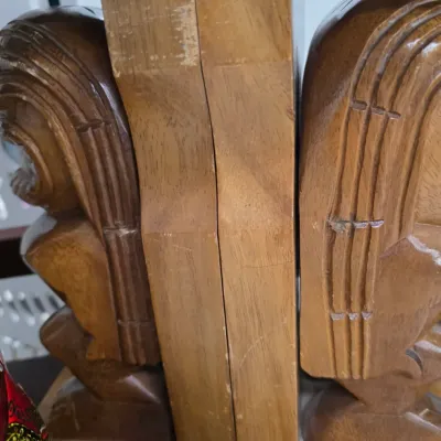 Sale Photo Thumbnail #103: Pair of vintage hand-carved wooden Tiki bookends, showing some wear and scuffs to the finish.