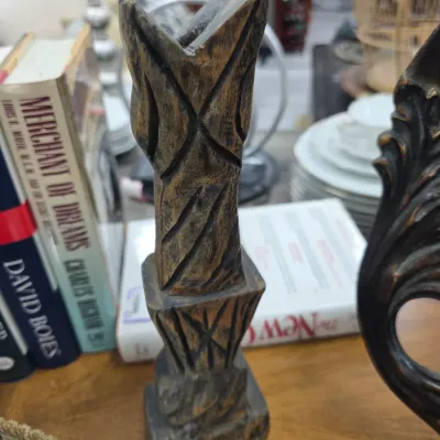 Sale Photo Thumbnail #27: Hand-carved wooden abstract sculpture with geometric incisions, displayed on a wooden table alongside books.