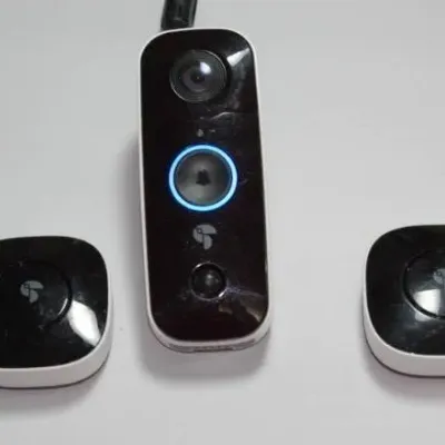 Sale Photo Thumbnail #11: Toucan smart video doorbell with two wireless chime units, featuring a black and white finish.