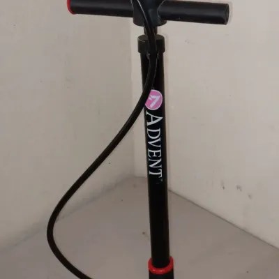 Sale Photo Thumbnail #44: Advent manual bicycle floor pump in black with red accents, featuring a T-handle and flexible hose.
