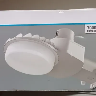 Sale Photo Thumbnail #17: Commercial Electric LED Area Light in its original box, featuring 7000 lumens, dusk-to-dawn operation, and a gray finish.
