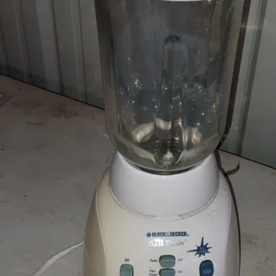 Sale Photo Thumbnail #48: Black & Decker Crush Blender with a white base, multi-button speed controls, and a clear glass pitcher.