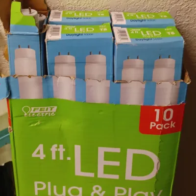 Sale Photo Thumbnail #33: Feit Electric 10-pack of 4-foot T8 LED Plug & Play light bulbs in daylight 5000K, showing some wear to the outer packaging.