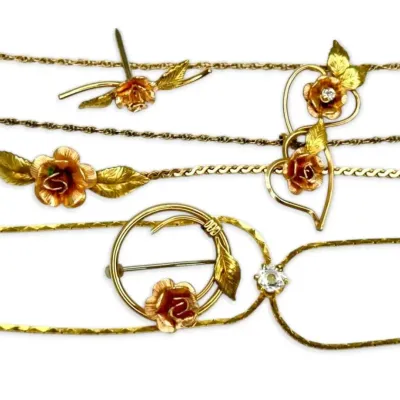Matching gold toned krementz rose jewelry