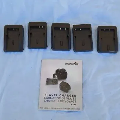 Digipower TC-550 travel charger kit, including five interchangeable battery charging plates and the original user guide.