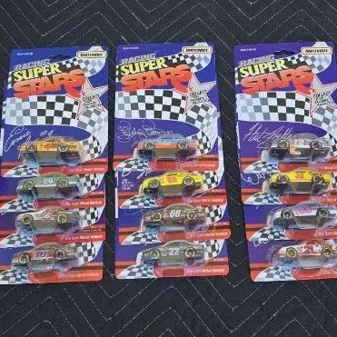 Collection of vintage Matchbox Racing Super Stars die-cast stock cars, individually sealed on original blister cards.