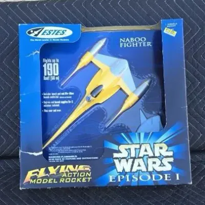 Estes Star Wars Episode I Naboo Fighter flying action model rocket, new in original box, circa 1999.