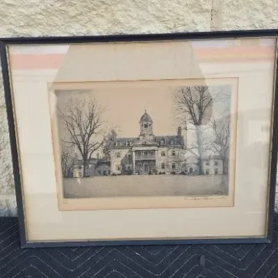 Framed and matted architectural etching depicting a historic estate or university building, signed and numbered by the artist.