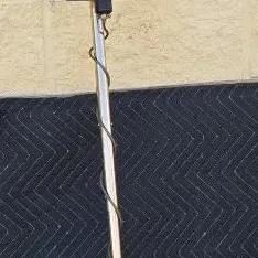 Vintage White's Electronics Goldmaster 4B metal detector, featuring a blue textured control box and circular search coil.
