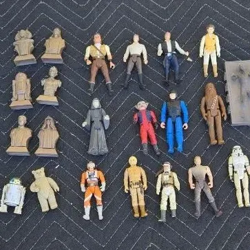 Collection of vintage Kenner Star Wars action figures and micro-busts from the late 1970s and 1980s, showing moderate play wear.