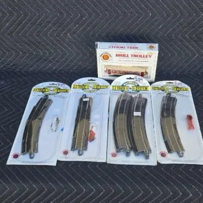 Bachmann Brill Trolley in its original box, accompanied by four sealed packages of Bachmann E-Z Track system pieces.