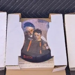 Three vintage Norman Rockwell collector plates, including "The Doctor and the Doll," "The Accordionist," and...